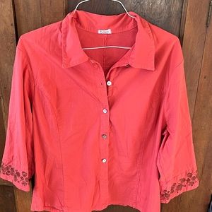 Embroidered orange top with brown embroidered florals.